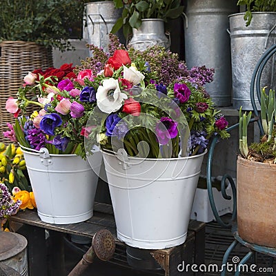 Bouquet from pink tulips, violet grape hyacinths, anemones, violet veronica and white buttercup Stock Photo