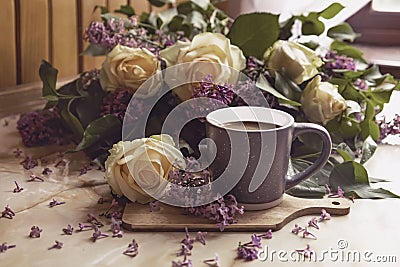 Bouquet of purple lilacs with yellow roses. Gray cup of coffee. Romantic spring flowers. Stock Photo