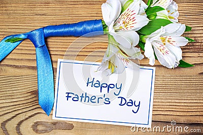 Bouquet, ribbon, card. Happy Father's Day Stock Photo
