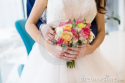 Bouquet of roses in hands of the bride Stock Photo