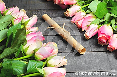 Bouquet of roses and letter scroll Stock Photo