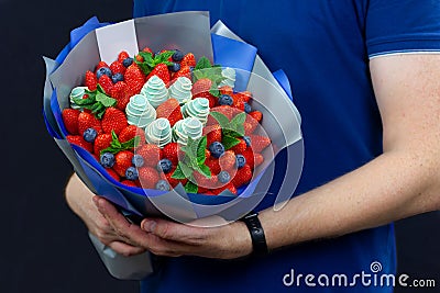 Bouquet of strawberries, blueberries and mint Stock Photo