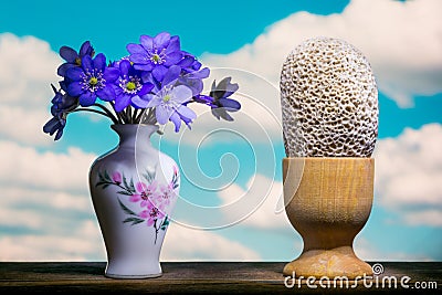 Bouquet and surrealistic eggs on a blue sky Stock Photo