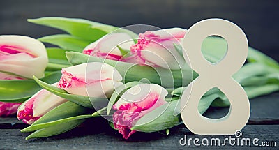 Bouquet of Tulips on dark rustic wooden background. Spring flowe Stock Photo
