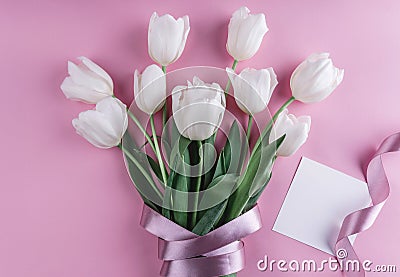 Bouquet of white tulips flowers and sheet of paper over light pink background. Stock Photo