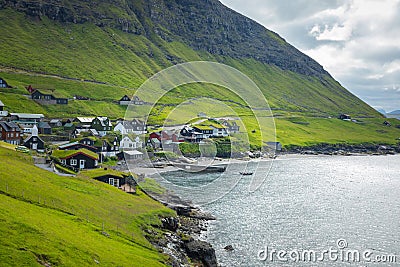 Bour village. Typical grass-roof houses and green mountains. Vagar island, Faroe Islands. Denmark. Europe Stock Photo