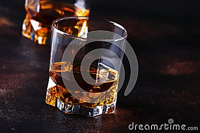 Bourbon in glass, american corn whiskey, dark bar counter, selective focus Stock Photo