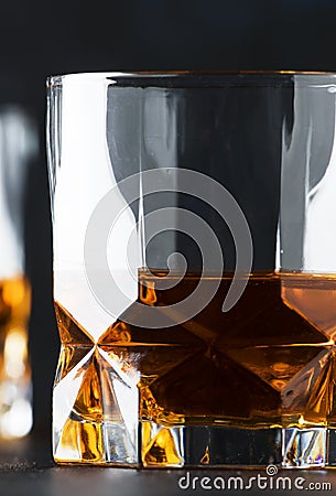 Bourbon in glass, american corn whiskey, dark bar counter, selec Stock Photo