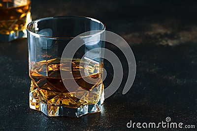 Bourbon in glass, american corn whiskey, dark bar counter, selective focus Stock Photo