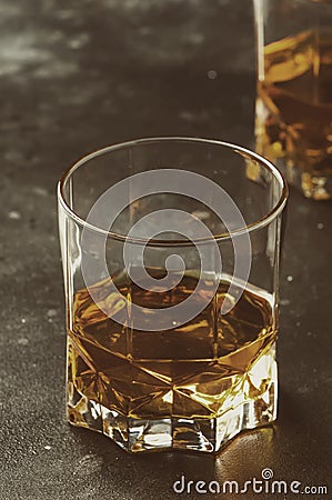 Bourbon in glass, american corn whiskey, dark bar counter, selective focus Stock Photo