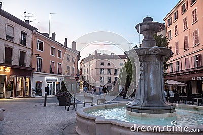 Place du 23 Aout 1944 Square, a pedestrian square with a fountain, in the center of Bourgoin, a typical town of French Dauphine Editorial Stock Photo