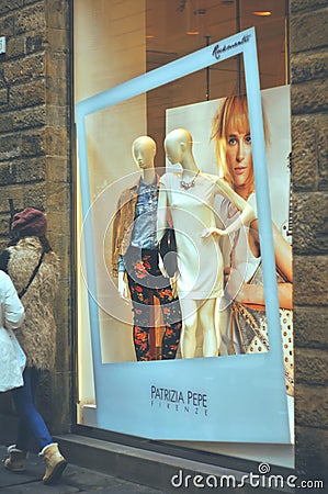 Boutique fashion display window with dressed mannequin in modern Editorial Stock Photo