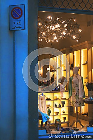 Boutique fashion display window with dressed mannequin in modern Editorial Stock Photo