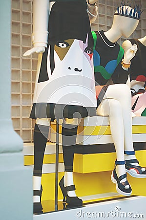 Boutique fashion display window with a legs and shoes of dressed Editorial Stock Photo