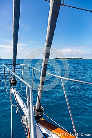 A bow pulpit, a yacht getting close to the Green Island in Great Coral Barrier, Cairns, Australia Stock Photo