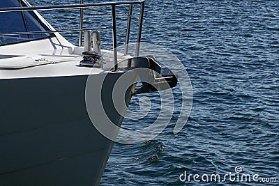 Bow of a sailing yacht against the blue sea with anchor at the bow. copy space, selective focus, narrow depth of field Stock Photo