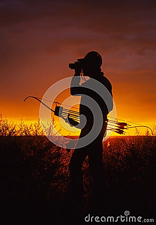 Bowhunter in Sunset Stock Photo