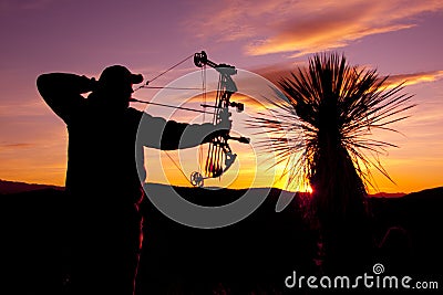 Bowhunter in Sunset Stock Photo