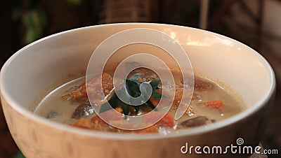 A bowl of banana and pumkin soup Stock Photo