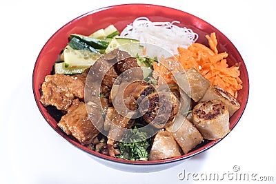 Bowl of beef Bo bun with salad, pork ribs, fresh herbs Stock Photo