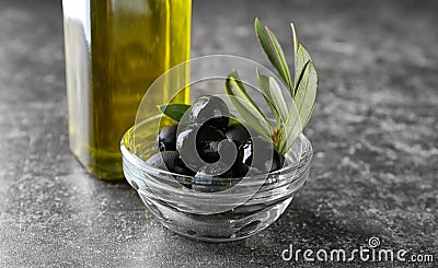 Bowl with black canned olives on table Stock Photo