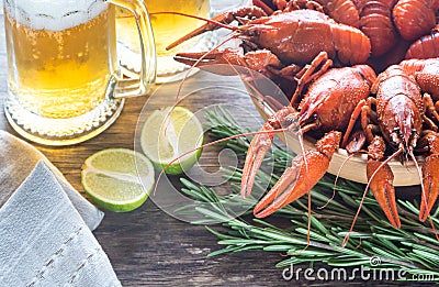 Bowl of boiled crayfish with two mugs of beer Stock Photo