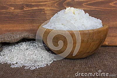 Bowl of boiled long grain rice with butter. Stock Photo