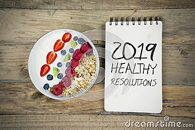 Bowl of cereal with text of 2019 healthy resolutions Stock Photo