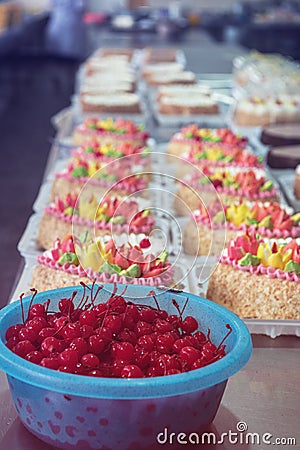Bowl of cherry on cake production Stock Photo