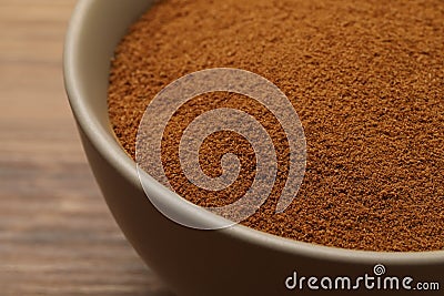 Bowl of chicory powder on wooden table, closeup Stock Photo