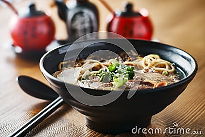 Bowl of chinese beef soup on table Stock Photo