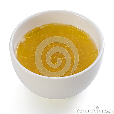 A bowl of clear chicken broth Stock Photo