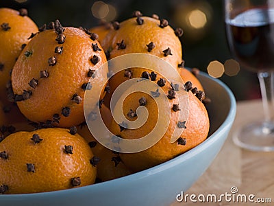 Bowl of Clove Studded Satsumas Stock Photo