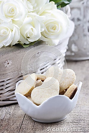 Bowl of cookies on rustic wooden table Stock Photo