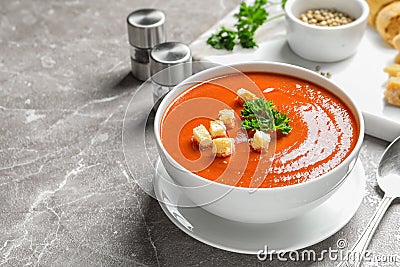 Bowl with delicious fresh homemade tomato soup on table Stock Photo