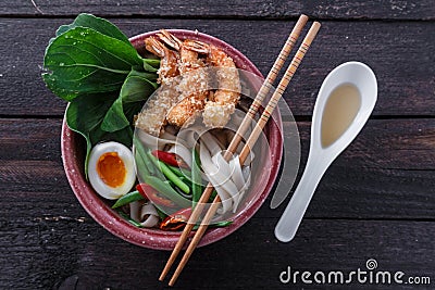 Bowl of delicious noodle soup with prawns Stock Photo