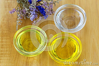 Bowl of different organic oil - cold pressed Coconut oil, Jojoba Stock Photo