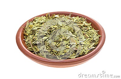 Bowl filled with cut and sifted senna leaf Stock Photo