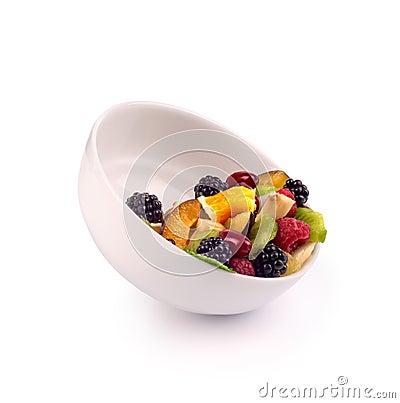 Bowl with fresh fruits salad and berries Stock Photo