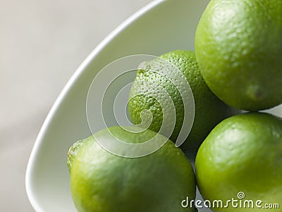 Bowl Of Fresh Limes Stock Photo