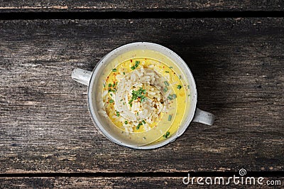 Bowl full of delicious vegan yellow lentil soup served with rice Stock Photo