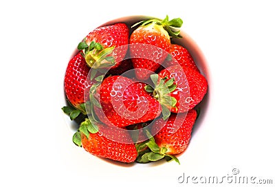 Bowl full of fresh and natural red strawberries with green leaves isolated on a seamless white background Stock Photo