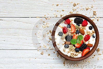 Bowl of greek yogurt with granola, oats, berries and nuts for healthy breakfast Stock Photo