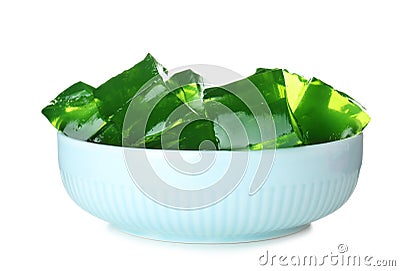 Bowl with green jelly cubes on background Stock Photo