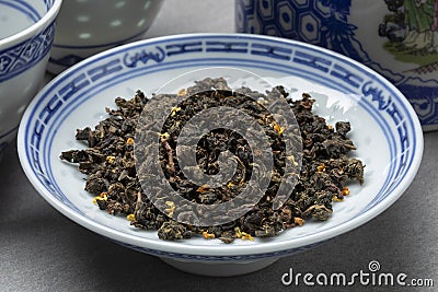 Bowl with Gui cha Osmanthus dried tea leaves close up Stock Photo