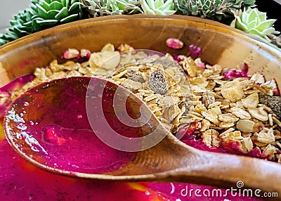 a bowl of healthy food, fresh dragon fruit smoothies with dried fruit Stock Photo