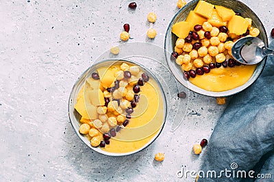 Bowl of healthy fresh mango on grey background. Stock Photo