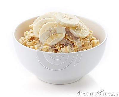 Bowl of healthy oatmeal isolated on white Stock Photo