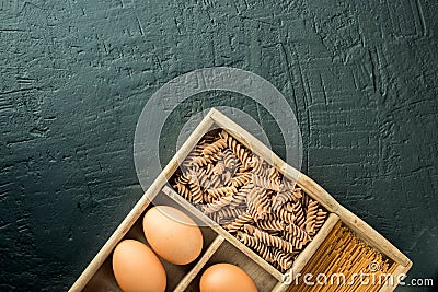 Bowl with healthy whole-grain carbohydrates and eggs, kamut, seeds, oats, brown rice, spaghetti Stock Photo