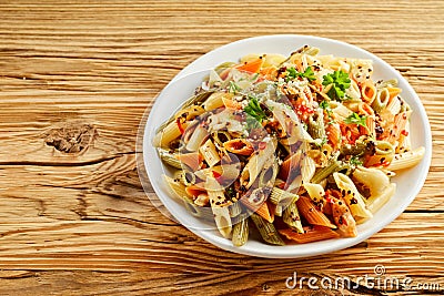 Bowl of healthy wholewheat penne rigate noodles Stock Photo